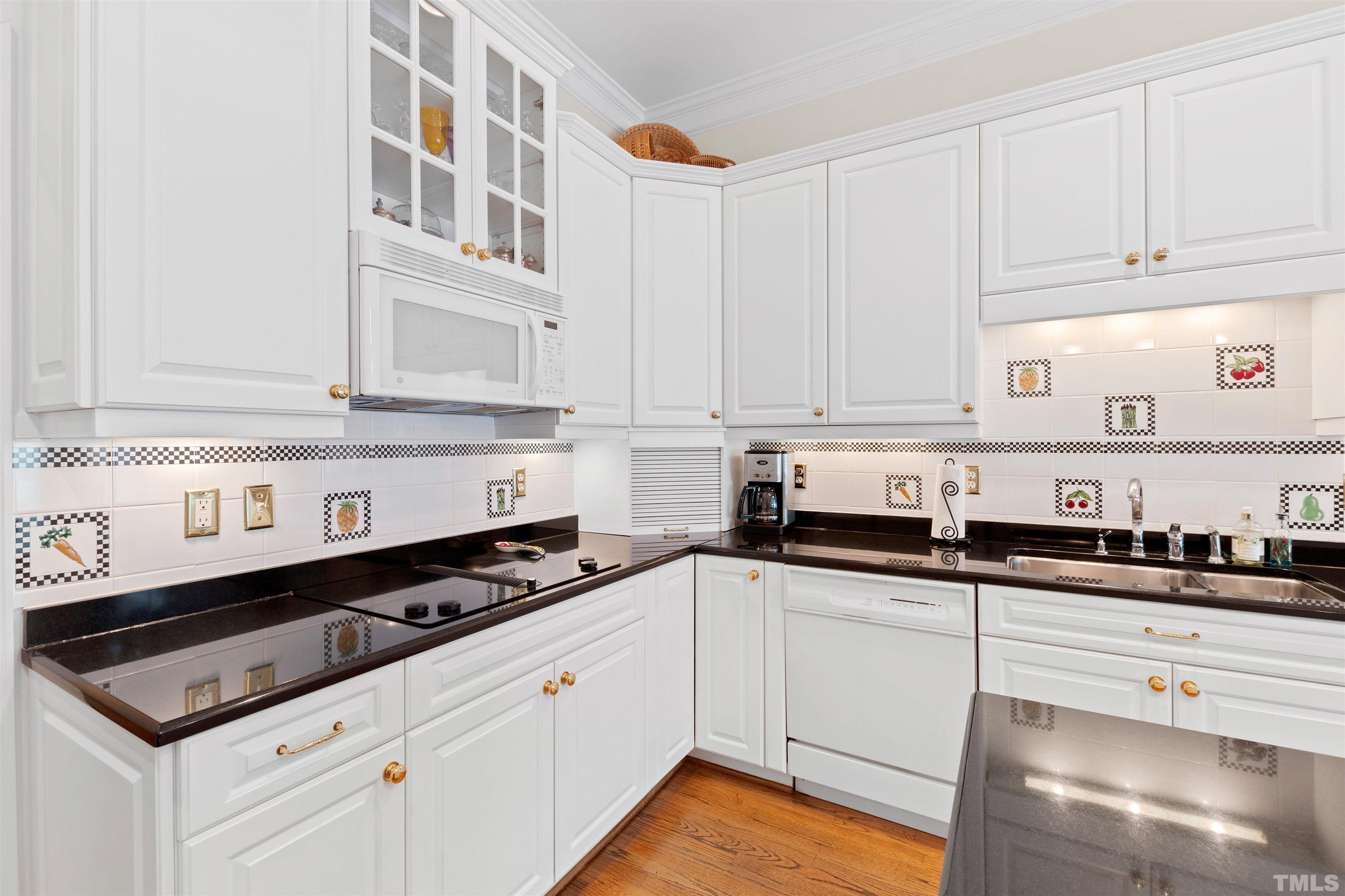 306 Lake Boone Trail Raleigh, NC 27608 - Photo 17 of 55 a kitchen with granite countertop a sink a stove and cabinets