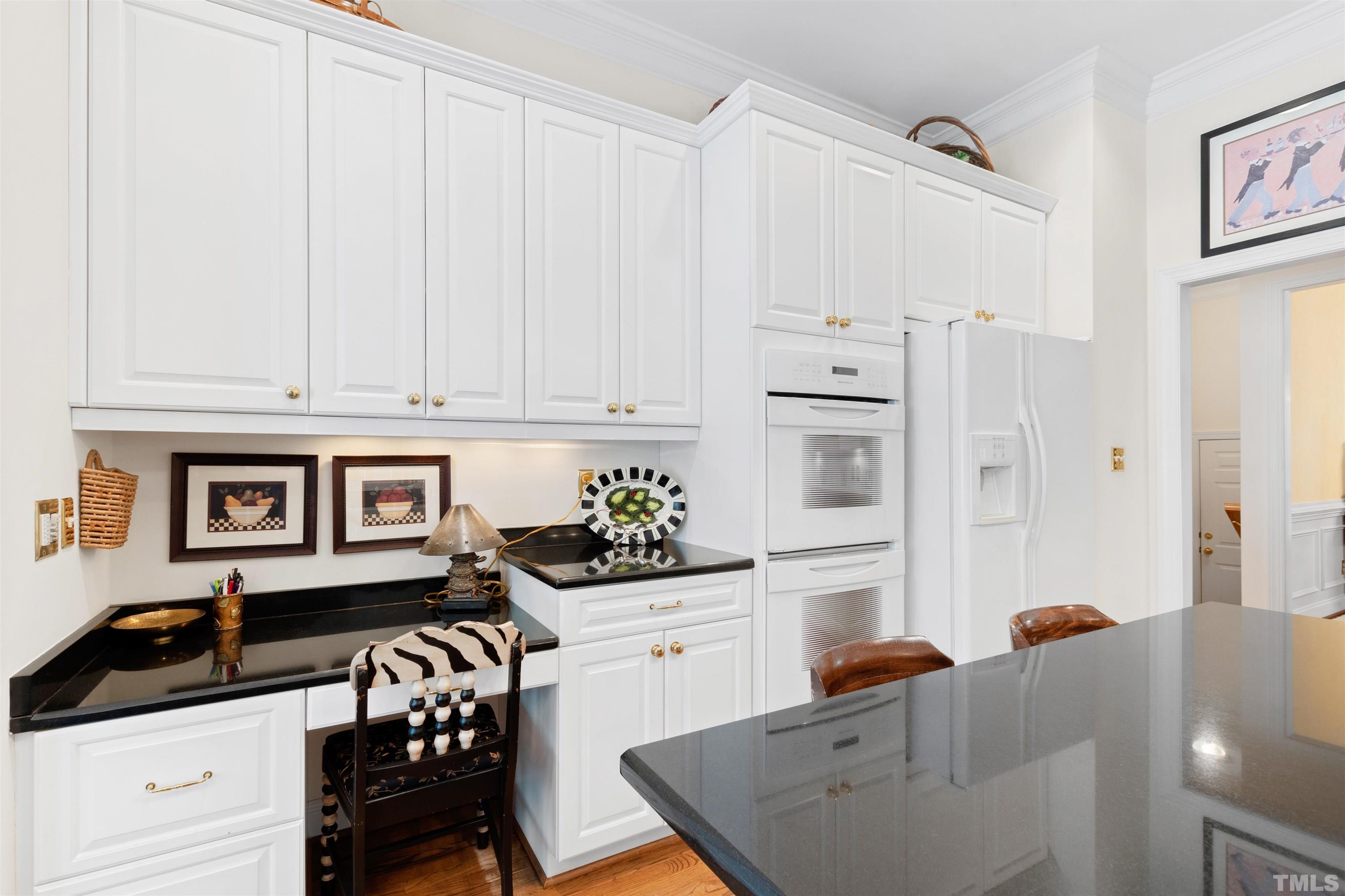 306 Lake Boone Trail Raleigh, NC 27608 - Photo 19 of 55 a kitchen with stainless steel appliances a stove a sink and white cabinets