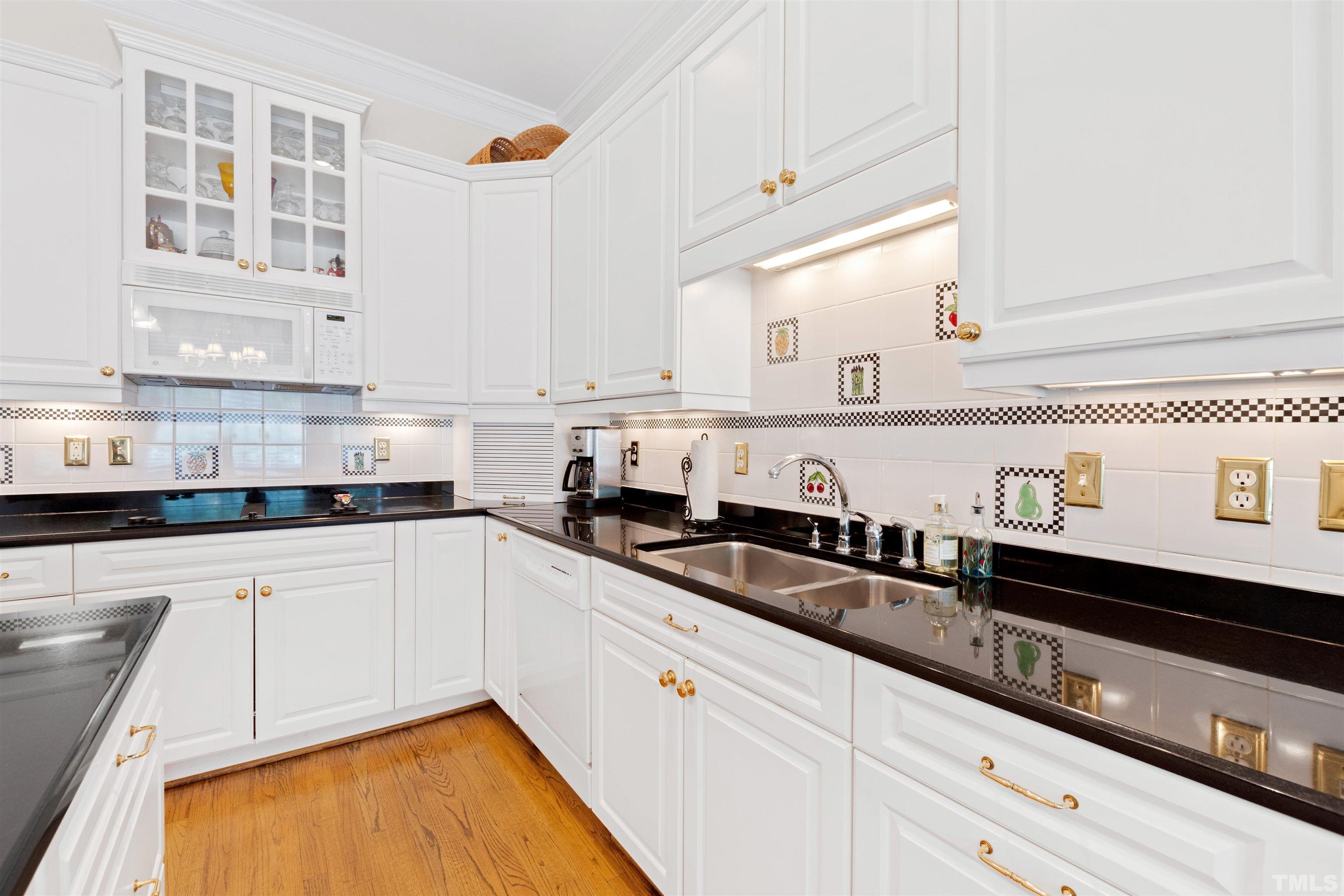 306 Lake Boone Trail Raleigh, NC 27608 - Photo 21 of 55 a kitchen with granite countertop white cabinets and sink