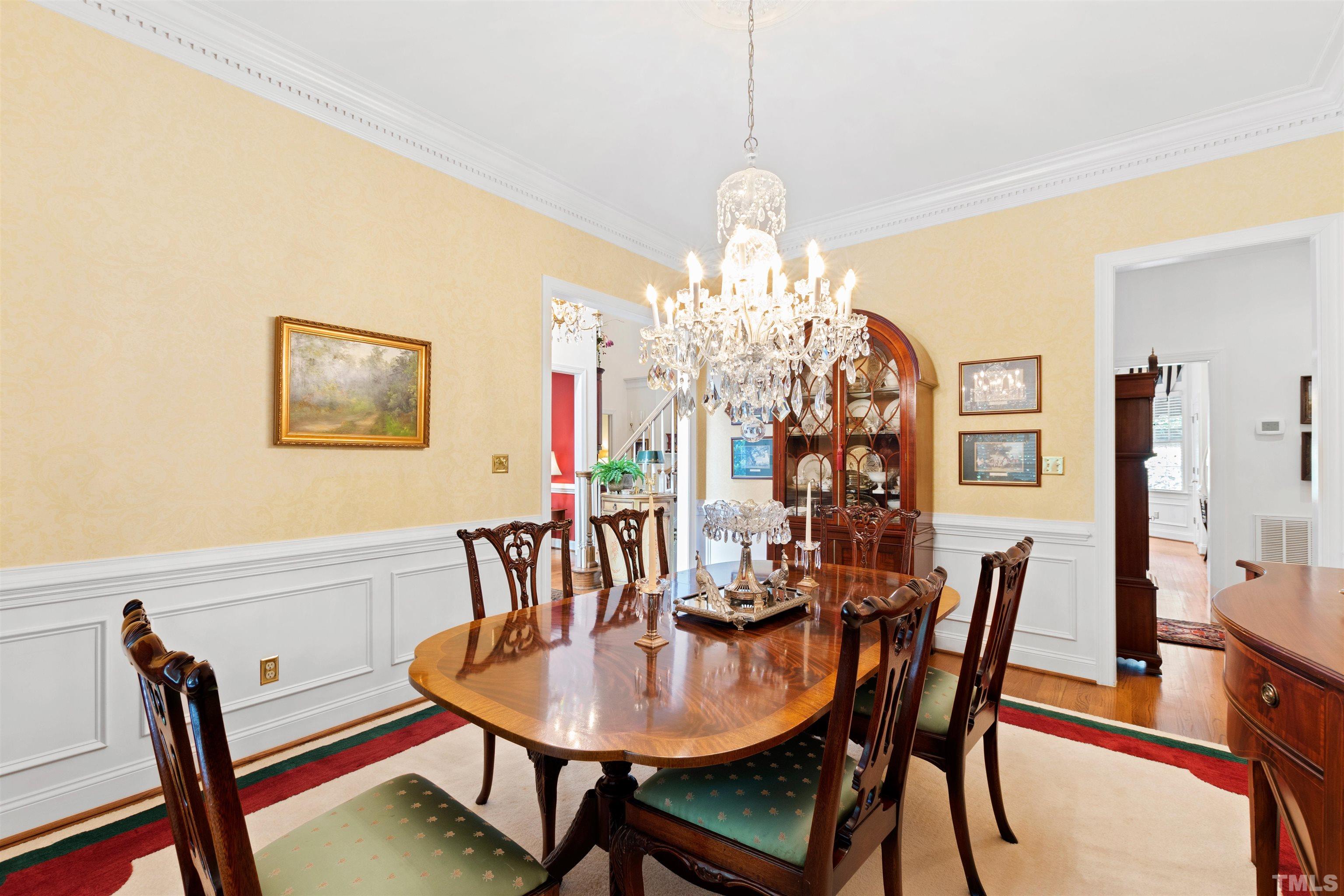 306 Lake Boone Trail Raleigh, NC 27608 - Photo 23 of 55 a view of a dining room with furniture and chandelier