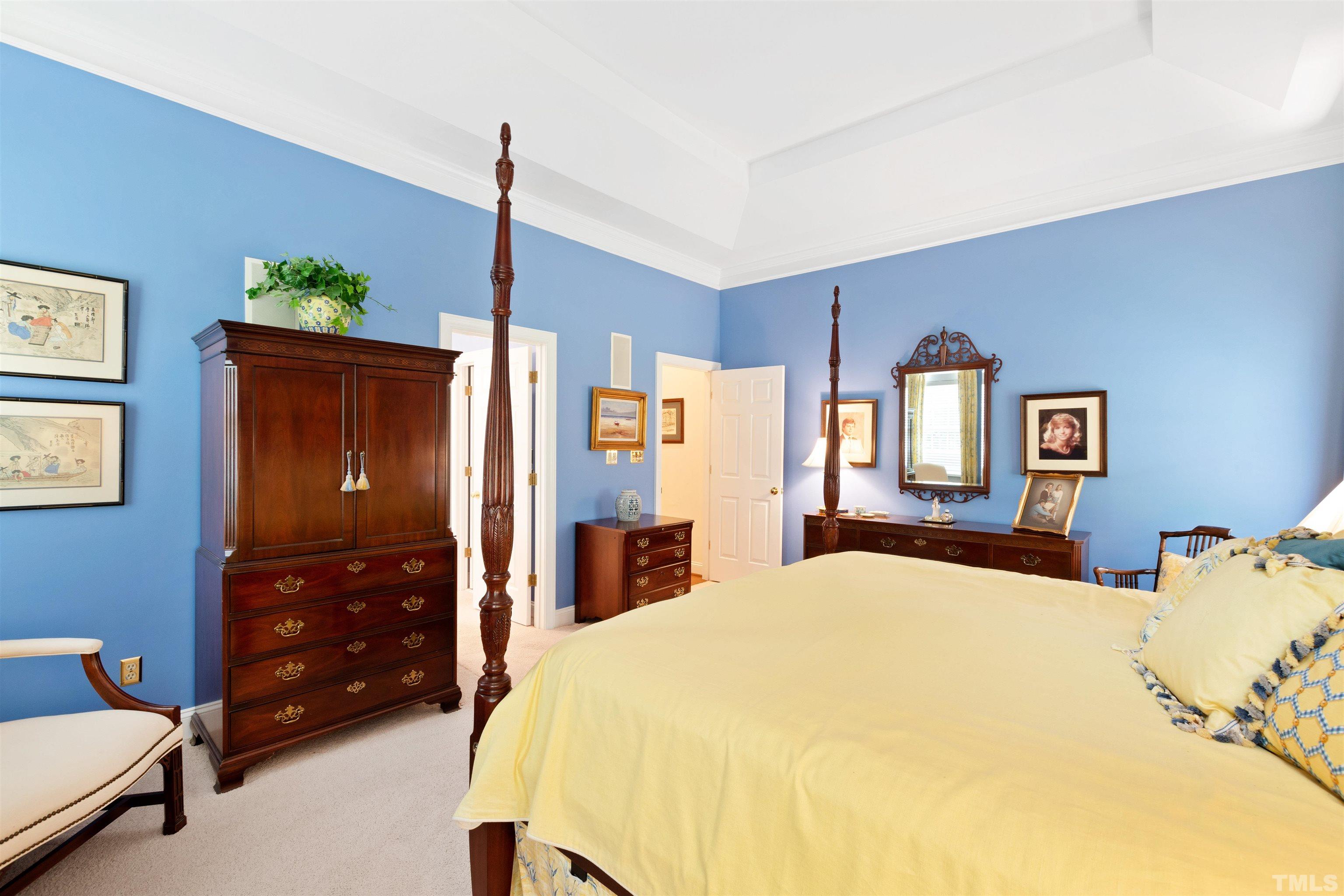 306 Lake Boone Trail Raleigh, NC 27608 - Photo 26 of 55 a bedroom with a bed a dresser and a chandelier