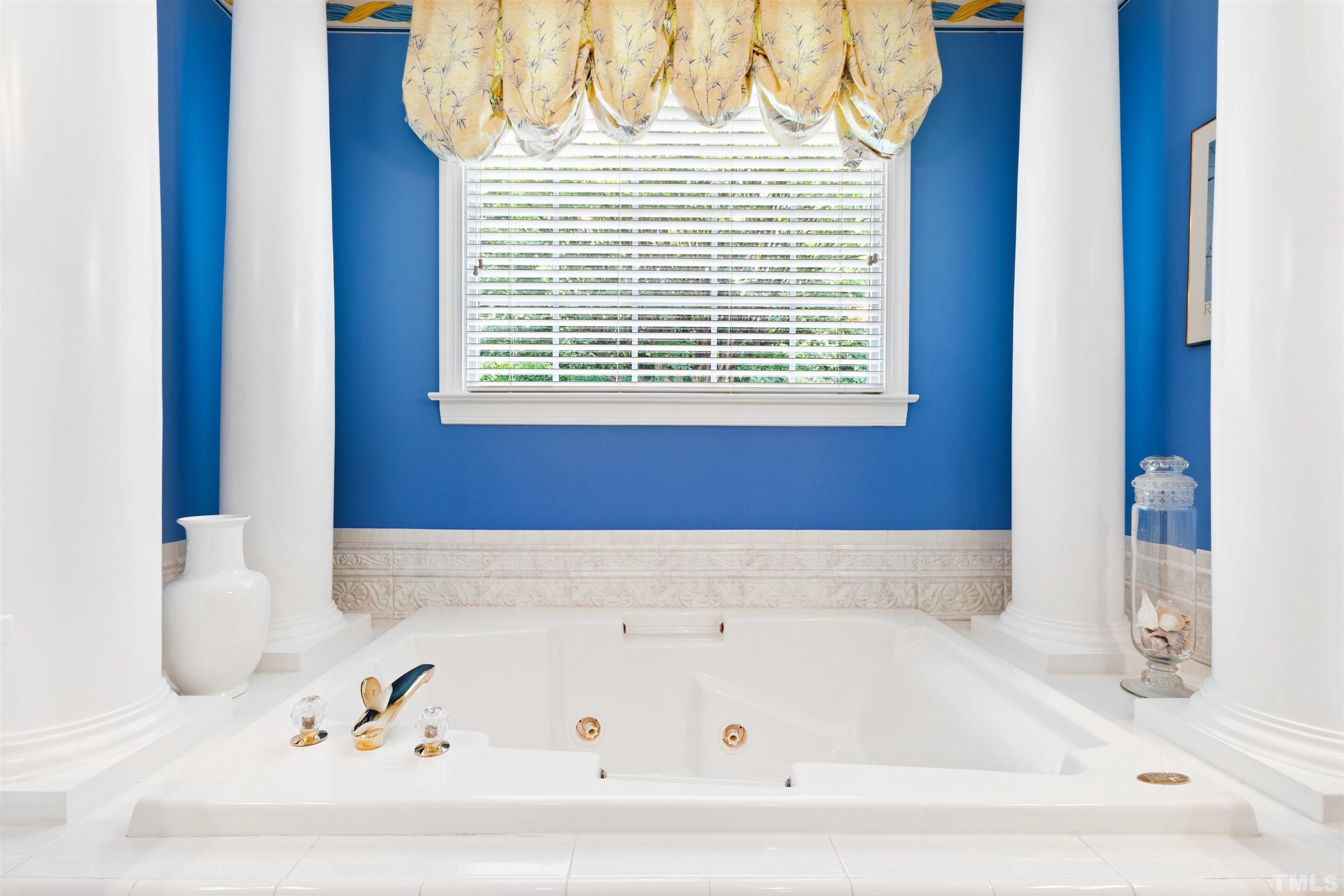 306 Lake Boone Trail Raleigh, NC 27608 - Photo 27 of 55 a bathroom with a bathtub and a window