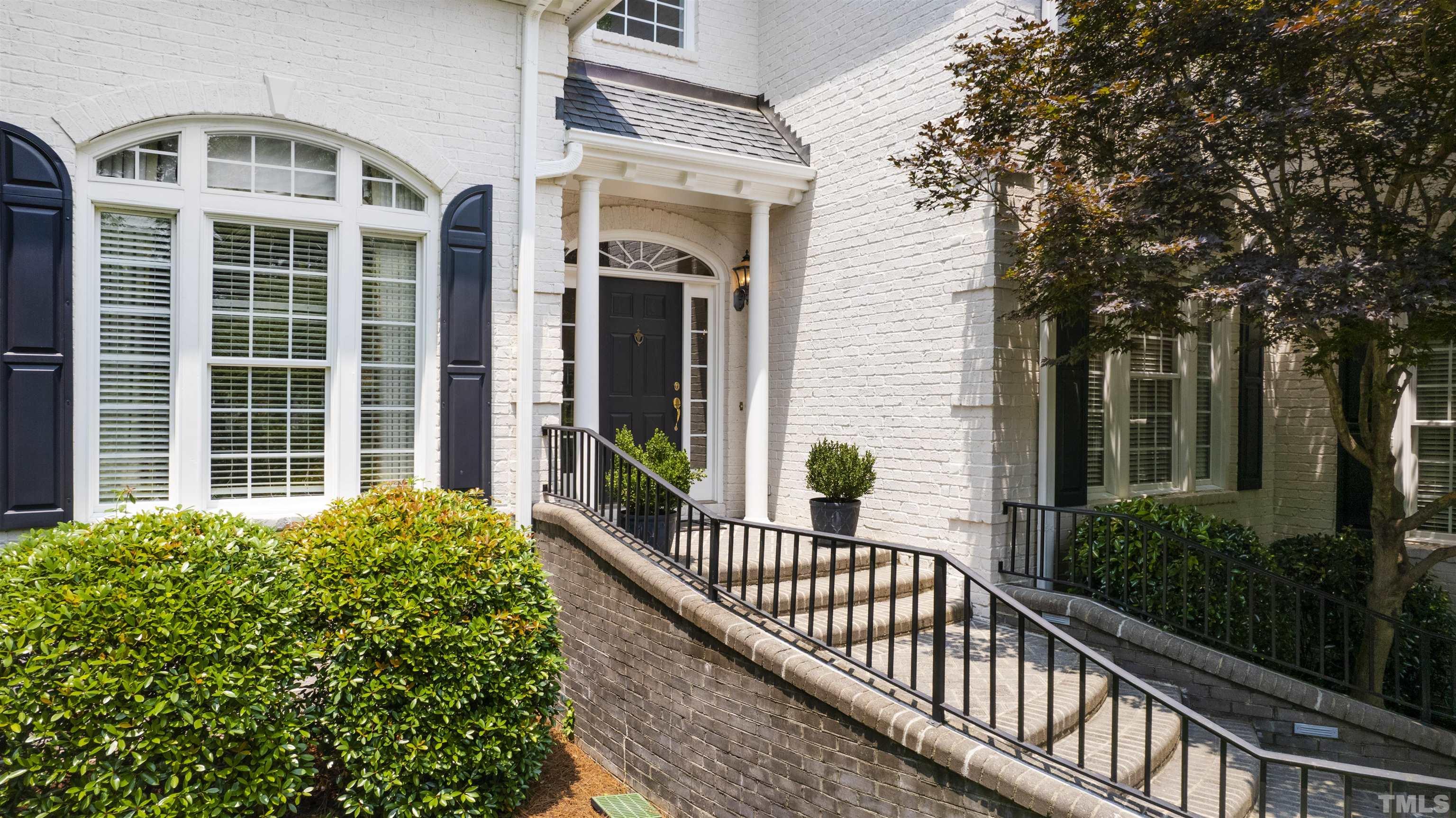 306 Lake Boone Trail Raleigh, NC 27608 - Photo 3 of 55 a view of a house with a large window and potted plants