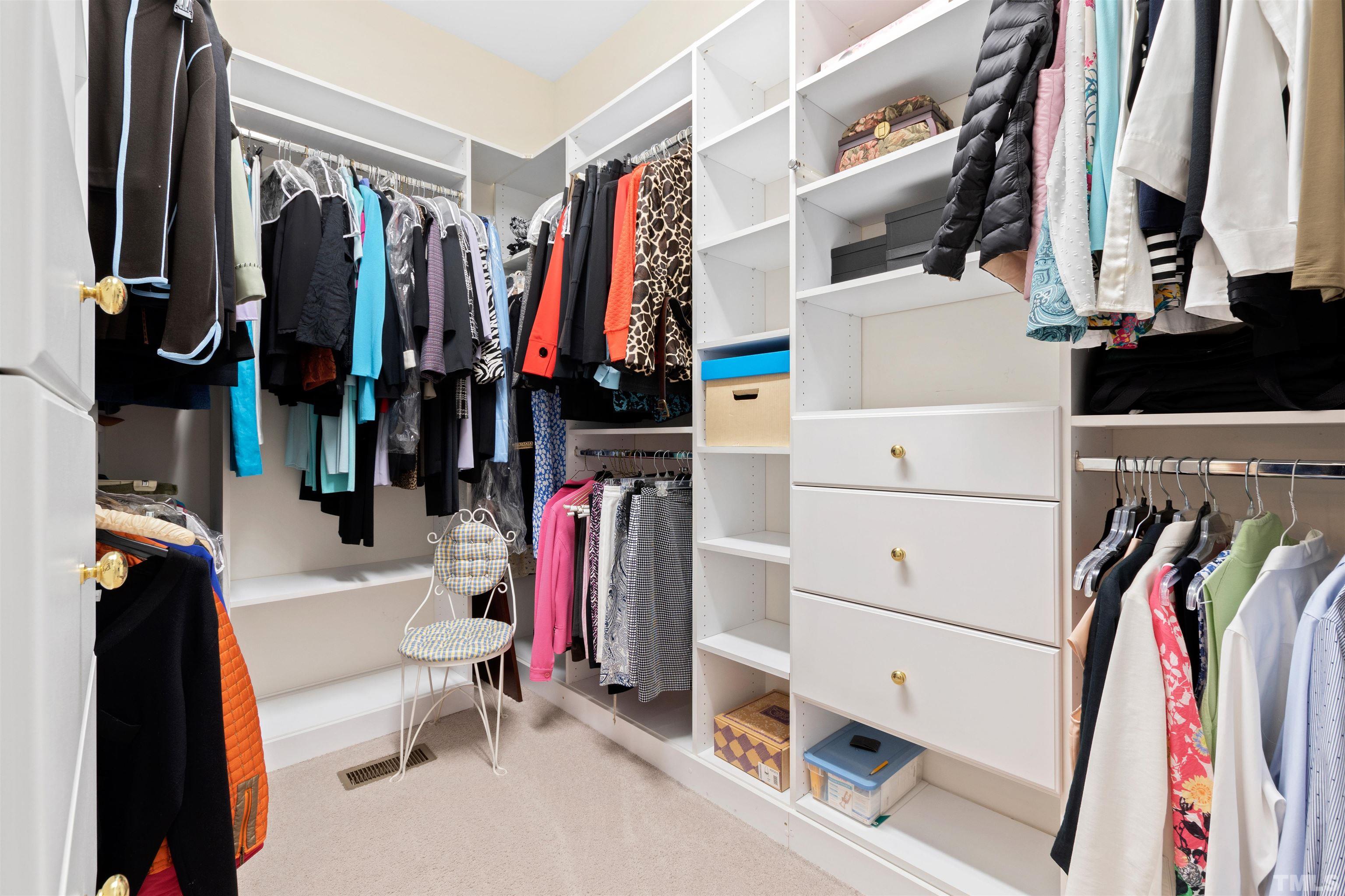 306 Lake Boone Trail Raleigh, NC 27608 - Photo 31 of 55 a view of walk in closet with clothes and shoes