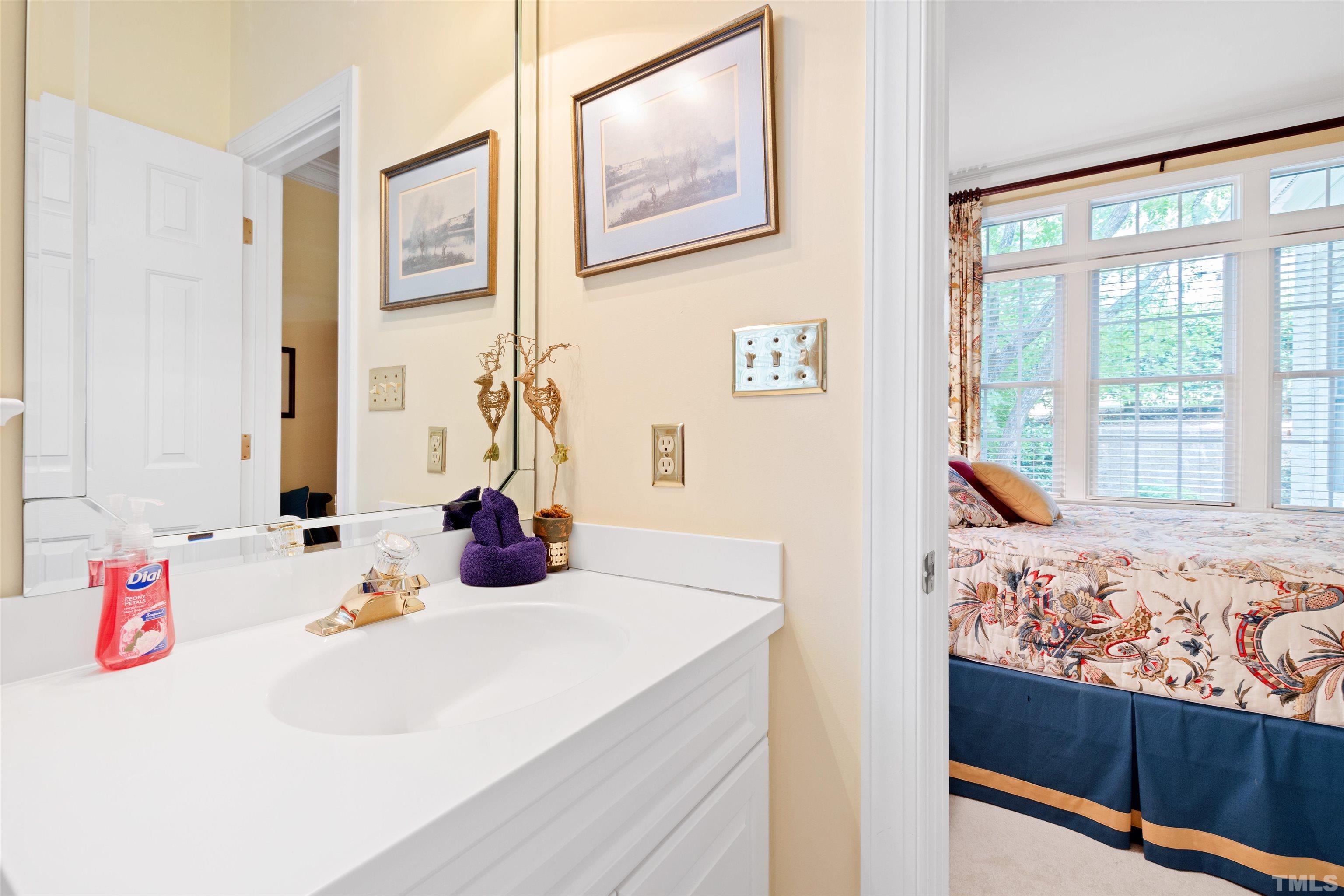 306 Lake Boone Trail Raleigh, NC 27608 - Photo 33 of 55 a bedroom with a bed and a dresser next to a window