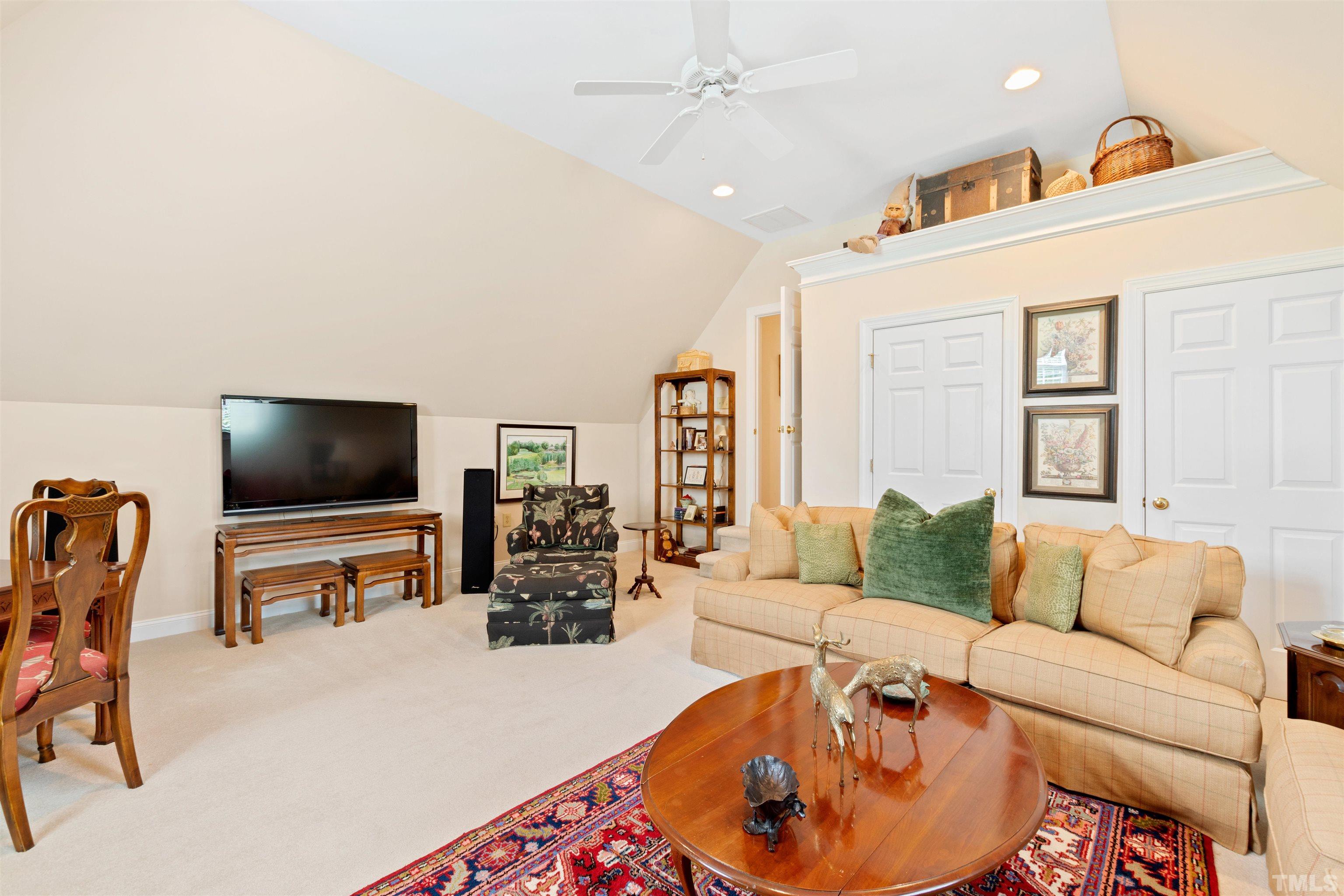 306 Lake Boone Trail Raleigh, NC 27608 - Photo 43 of 55 a living room with furniture and a flat screen tv