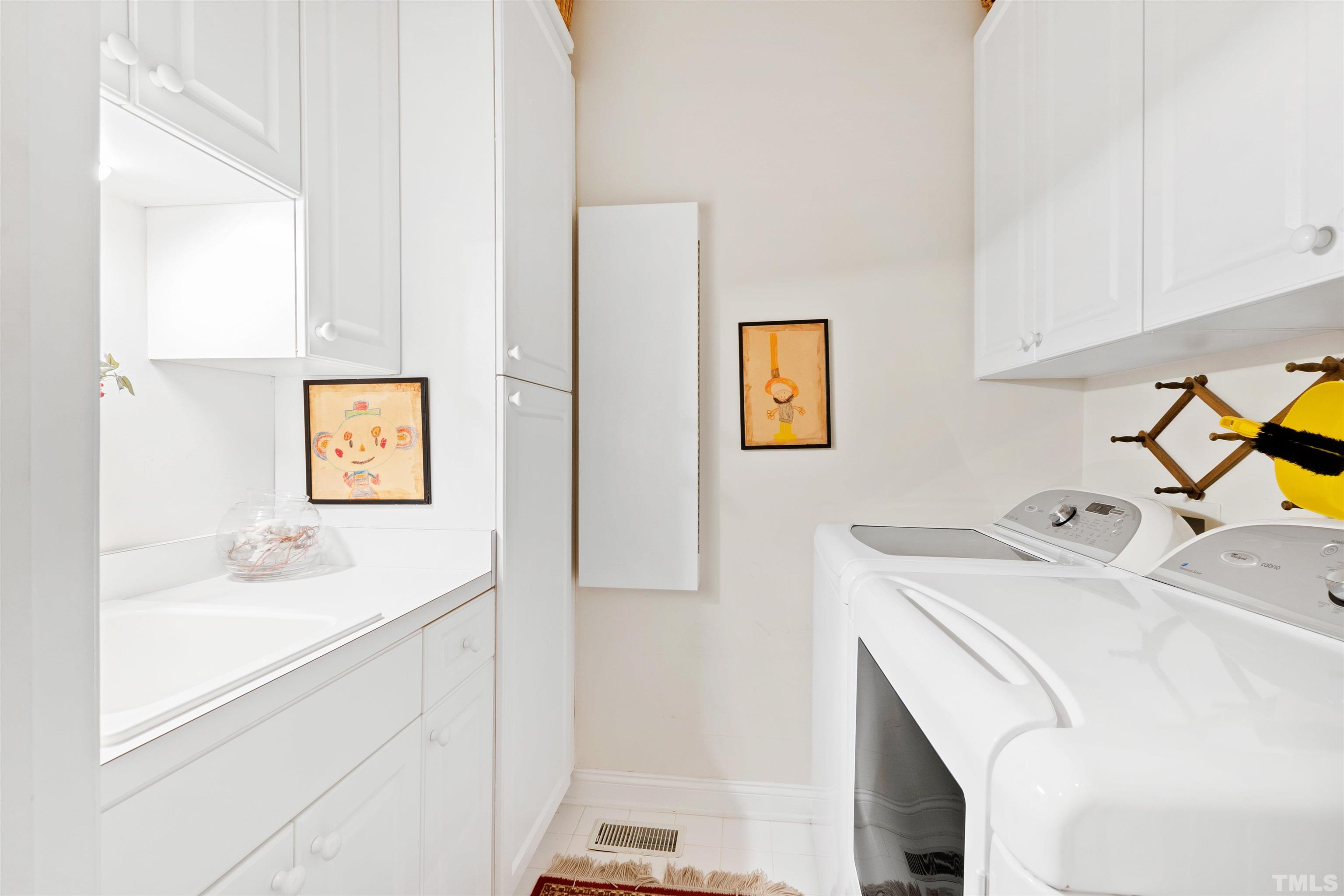306 Lake Boone Trail Raleigh, NC 27608 - Photo 47 of 55 a utility room with dryer and washer