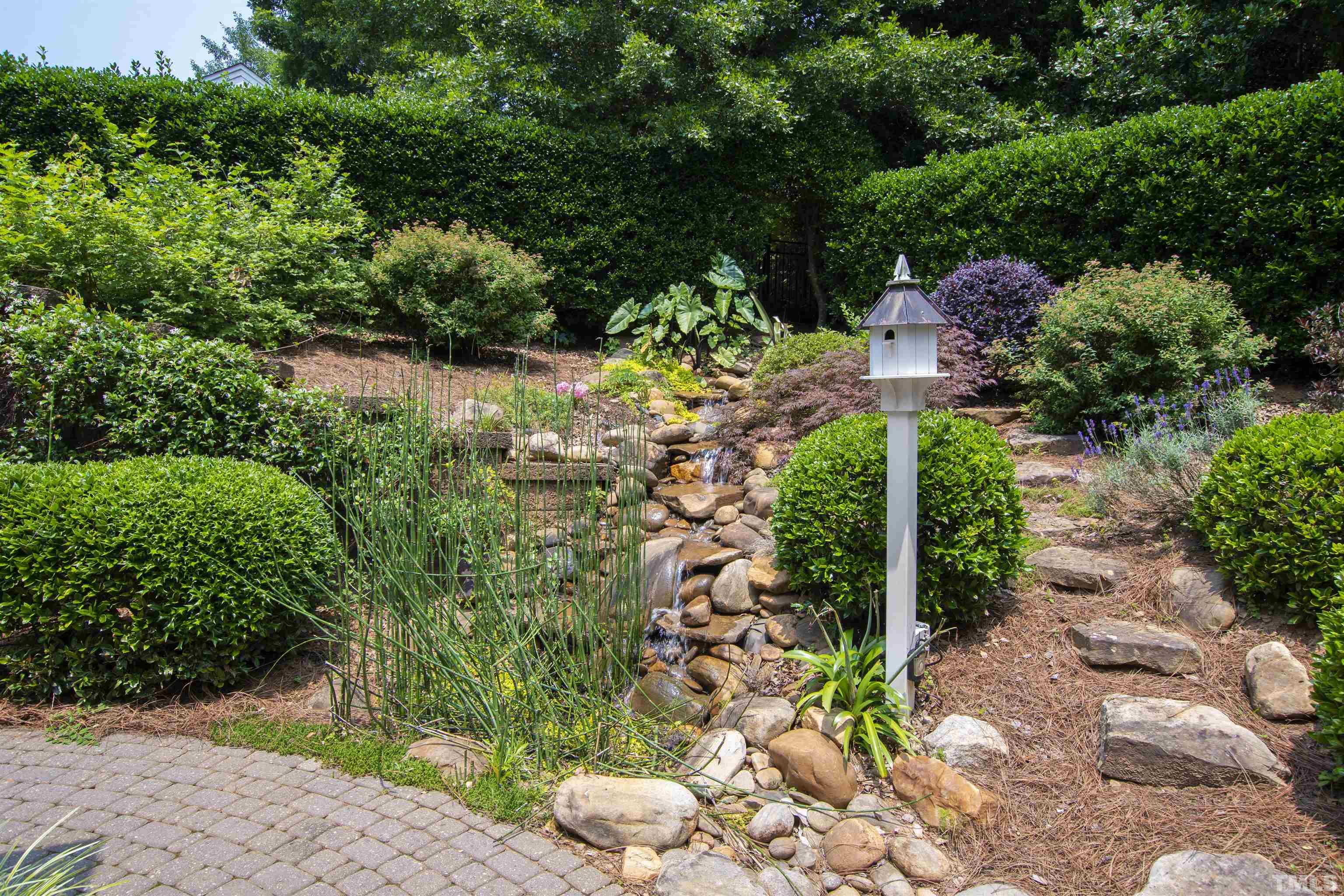 306 Lake Boone Trail Raleigh, NC 27608 - Photo 49 of 55 a backyard of a house with lots of green space