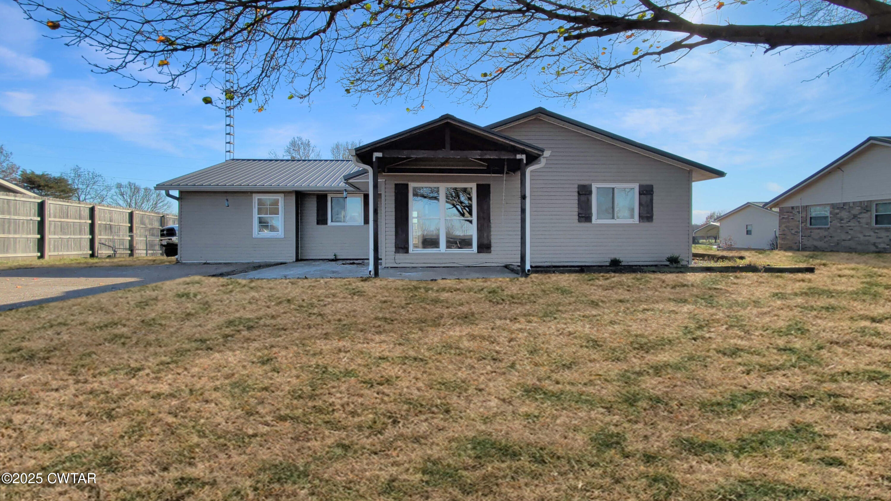 a house with trees in the background