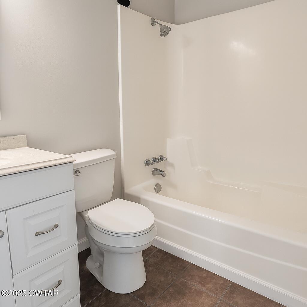 91 Currie Road Dyer, TN 38330 - Photo 12 of 13 a bathroom with a toilet and a bathtub
