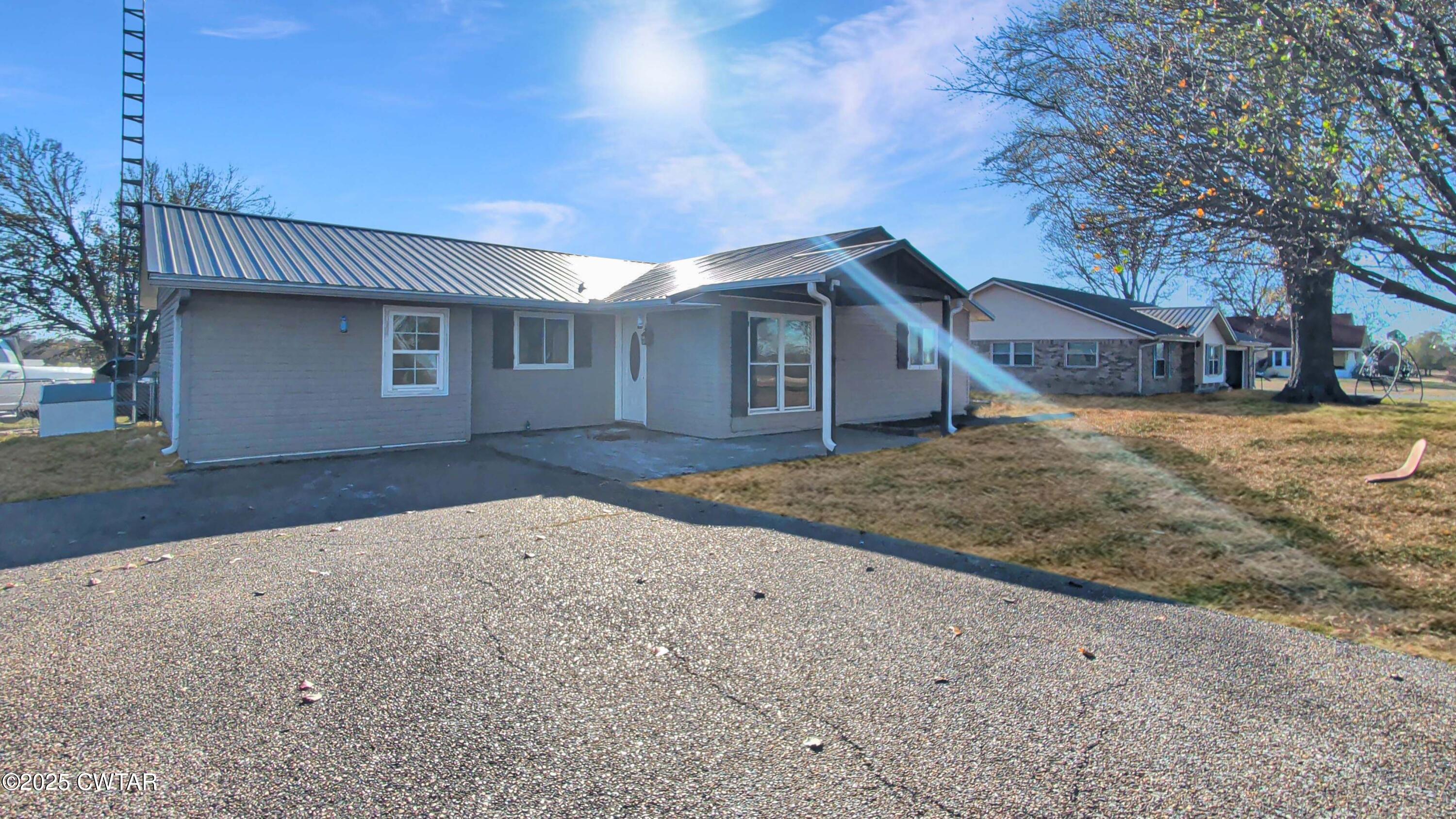 91 Currie Road Dyer, TN 38330 - Photo 2 of 13 a front view of a house with a yard