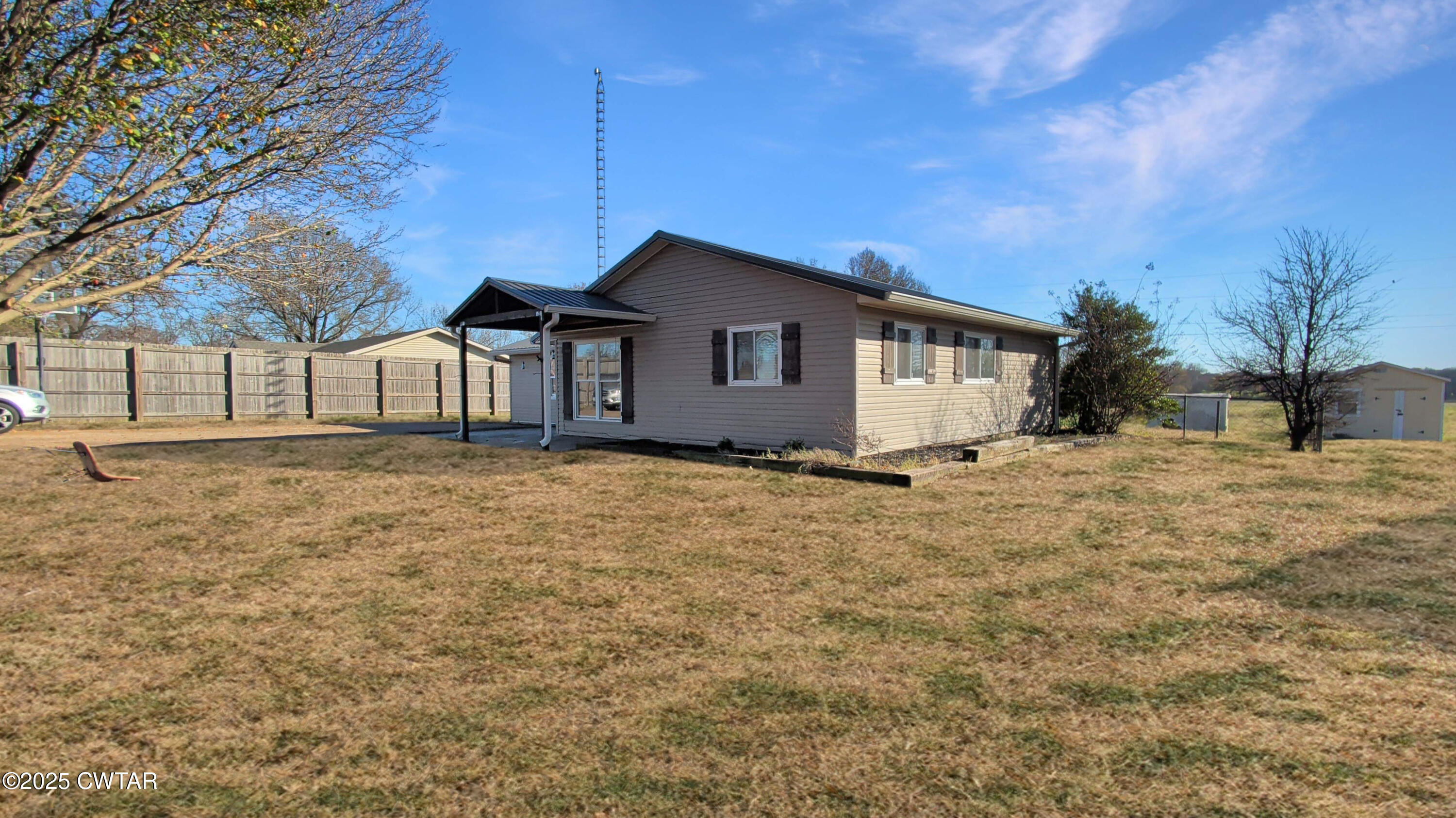 91 Currie Road Dyer, TN 38330 - Photo 3 of 13 a house with trees in the background