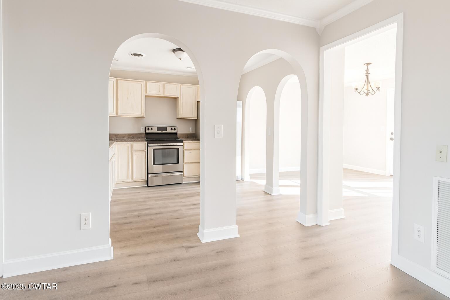 91 Currie Road Dyer, TN 38330 - Photo 6 of 13 a view of a kitchen with wooden floor and electronic appliances