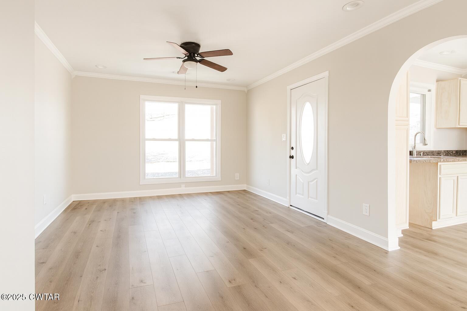 91 Currie Road Dyer, TN 38330 - Photo 7 of 13 a view of an empty room with wooden floor and a window