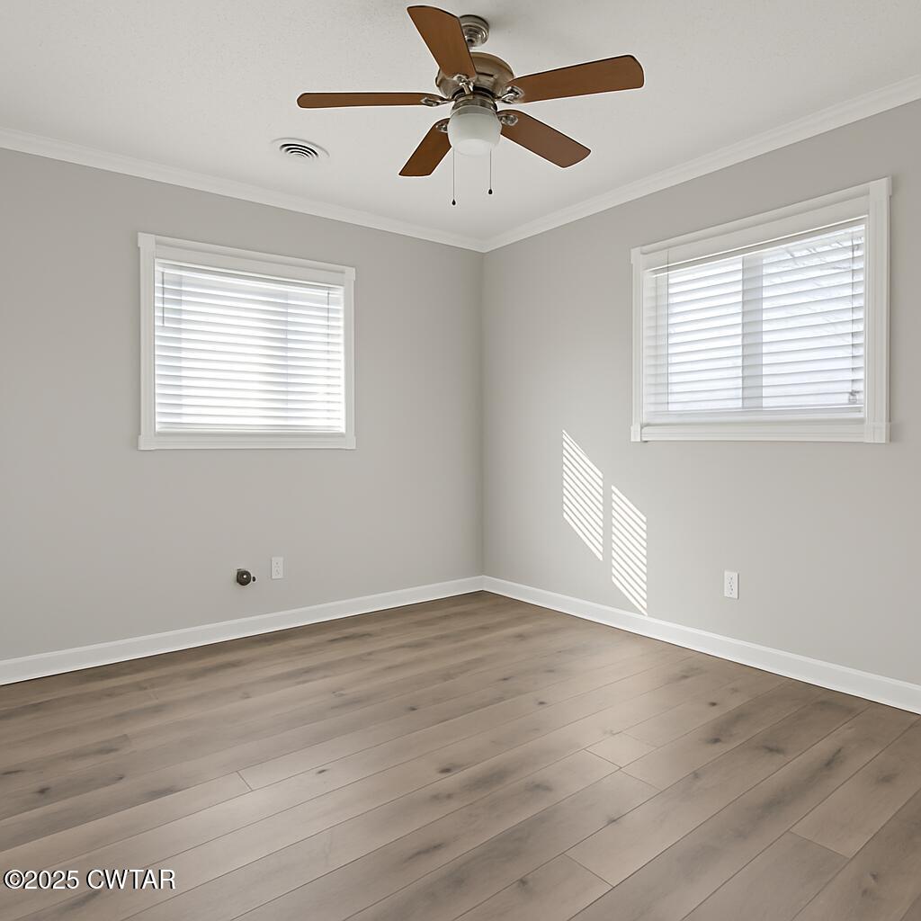 91 Currie Road Dyer, TN 38330 - Photo 10 of 13 a view of an empty room with wooden floor and a window
