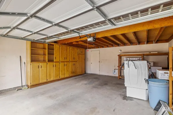 a view of a room with a table and chairs