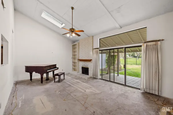 a kitchen with stainless steel appliances a stove refrigerator sink and cabinets
