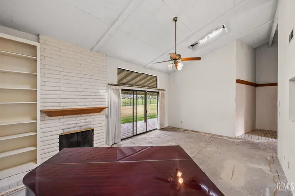 a kitchen with stainless steel appliances granite countertop a stove and a microwave