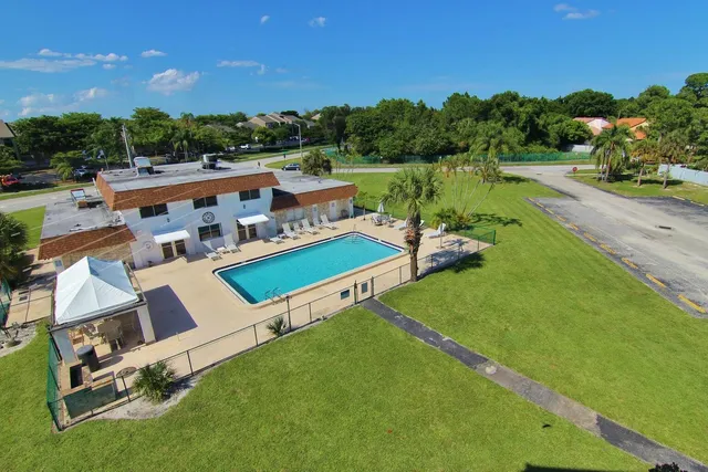 an aerial view of a house with outdoor space and lake view