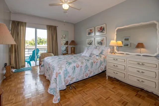 a bedroom with a large bed and a dresser