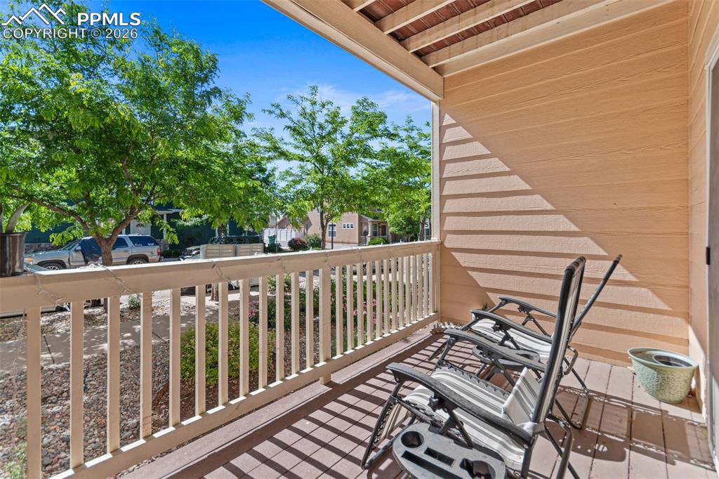 1563 Monterey Road, Unit B Colorado Springs, CO 80910 - Photo 13 of 27 a view of a balcony with wooden floor
