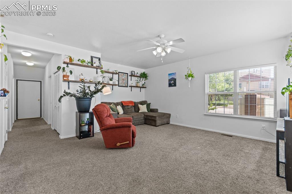 1563 Monterey Road, Unit B Colorado Springs, CO 80910 - Photo 15 of 27 a view of a livingroom with furniture and windows