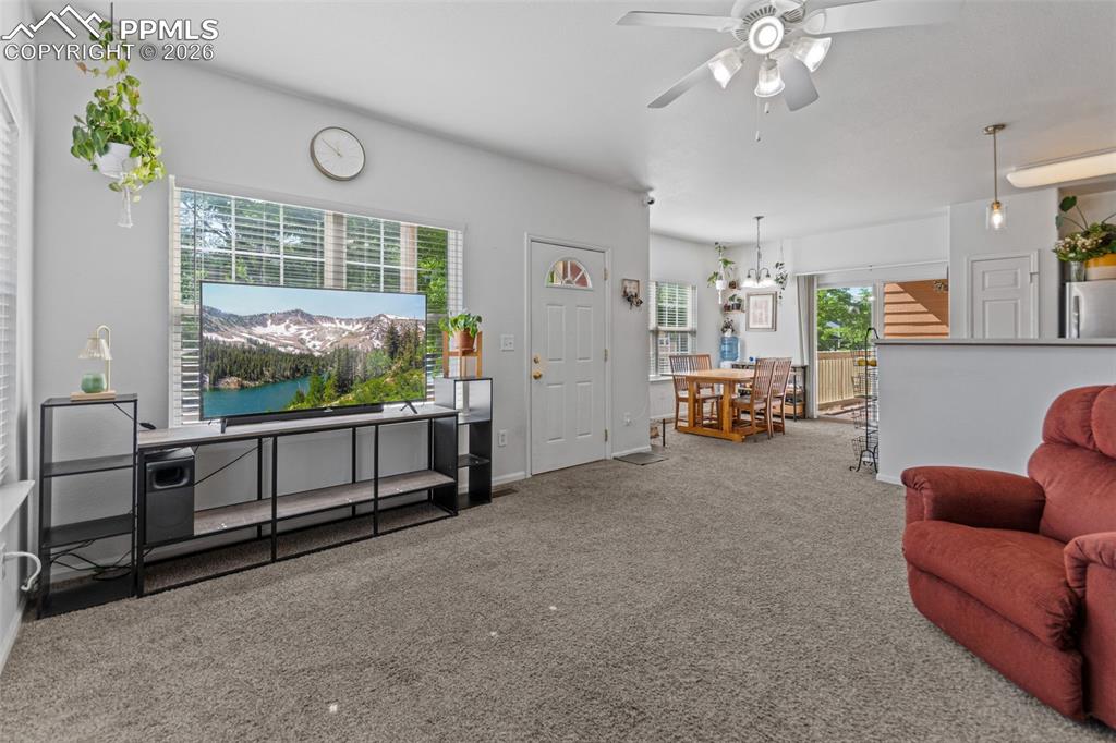 1563 Monterey Road, Unit B Colorado Springs, CO 80910 - Photo 17 of 27 a living room with furniture and a large window