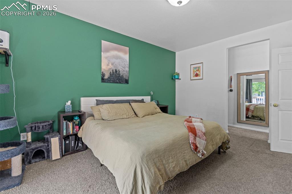 1563 Monterey Road, Unit B Colorado Springs, CO 80910 - Photo 20 of 27 a bedroom with a bed and a desk