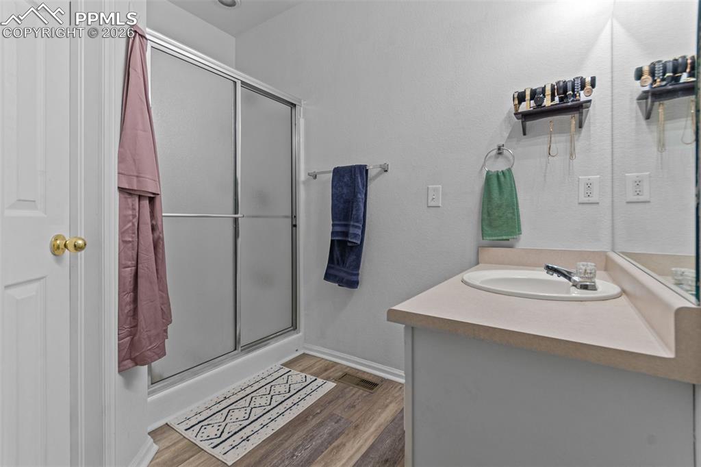 1563 Monterey Road, Unit B Colorado Springs, CO 80910 - Photo 21 of 27 a bathroom with a sink and a mirror