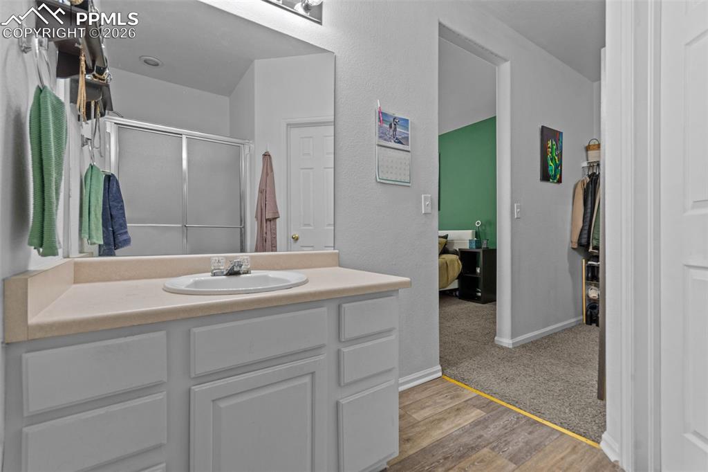 1563 Monterey Road, Unit B Colorado Springs, CO 80910 - Photo 22 of 27 a bathroom with a sink and a mirror