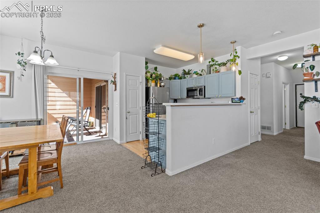 1563 Monterey Road, Unit B Colorado Springs, CO 80910 - Photo 4 of 27 a view of a dining room with furniture window and outside view