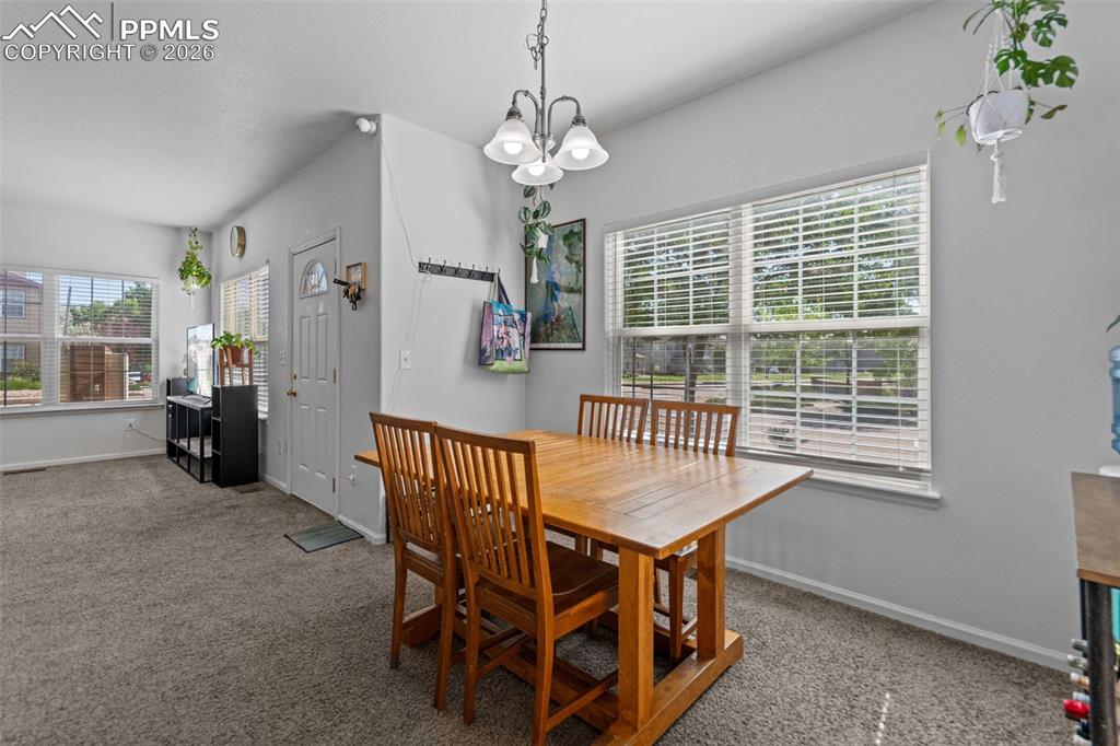 1563 Monterey Road, Unit B Colorado Springs, CO 80910 - Photo 7 of 27 a dining room with furniture and window