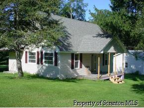 177 Rd Union Dale, PA 18470 - Photo 2 of 3 front view of a house with a yard