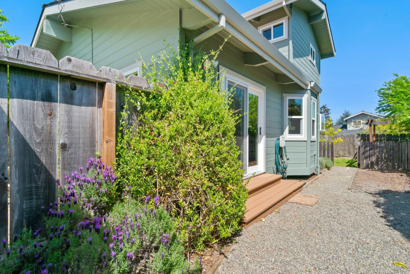 620 Sumner Street Santa Cruz, CA 95062 - Photo 27 of 45 a view of a house with a small yard and potted plants