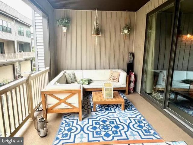 a living room with furniture and a rug