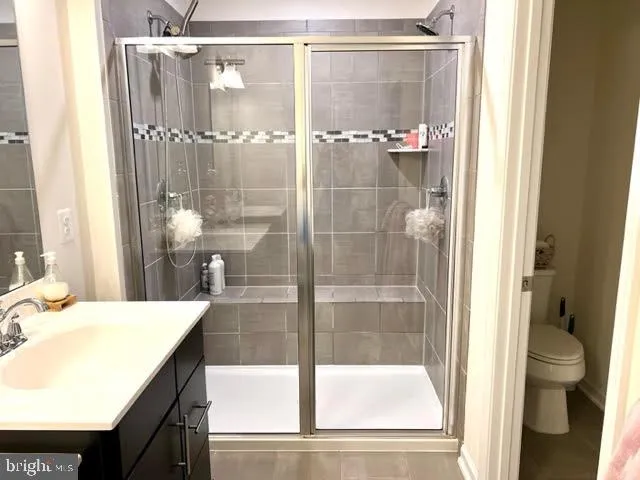 a bathroom with a shower and a sink