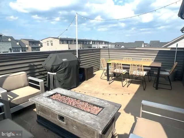 a terrace of a house with outdoor seating
