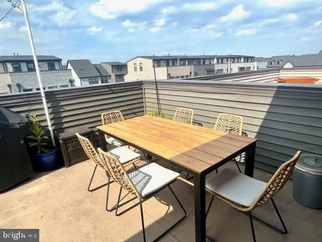 a view of a building with sitting area