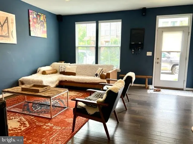 a reading room with furniture and wooden floor