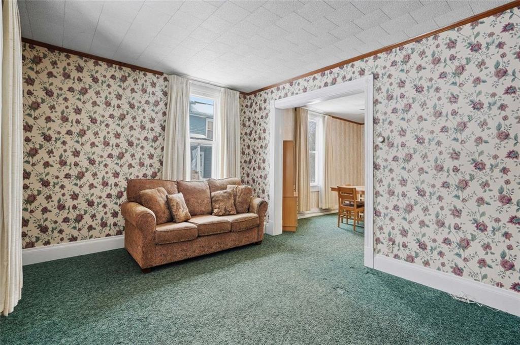 221 Kay Street Wampum, PA 16157 - Photo 11 of 39 a living room with a couch and a window