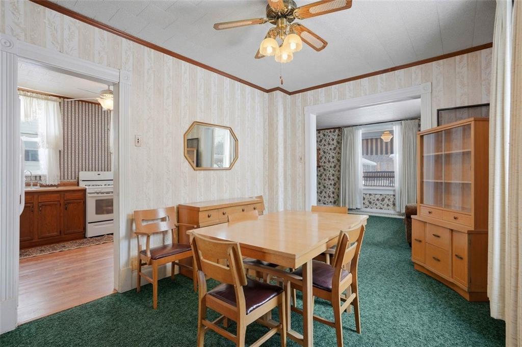 221 Kay Street Wampum, PA 16157 - Photo 15 of 39 a view of a dining room with furniture and wooden floor