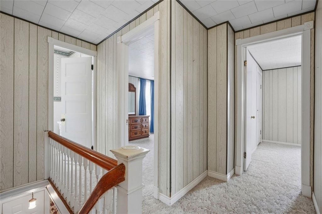 221 Kay Street Wampum, PA 16157 - Photo 21 of 39 a view of a hallway with wooden shelves