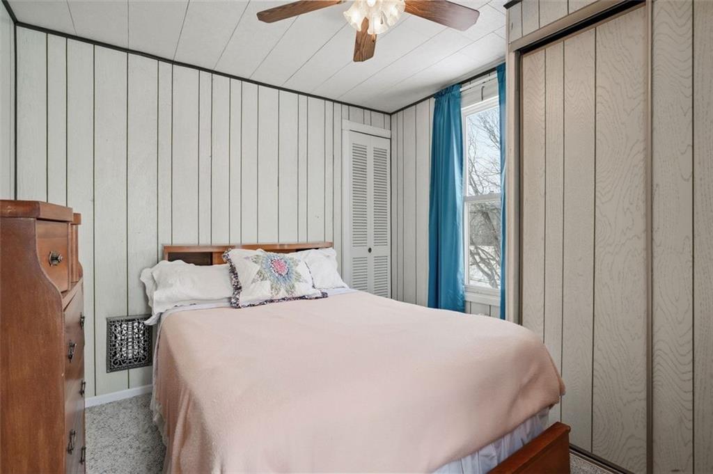 221 Kay Street Wampum, PA 16157 - Photo 22 of 39 a large bed sitting in a bedroom next to a window