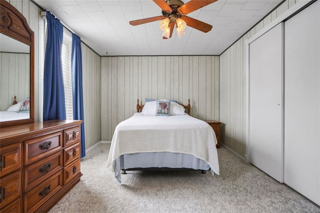 221 Kay Street Wampum, PA 16157 - Photo 28 of 39 a bedroom with a bed and a chandelier