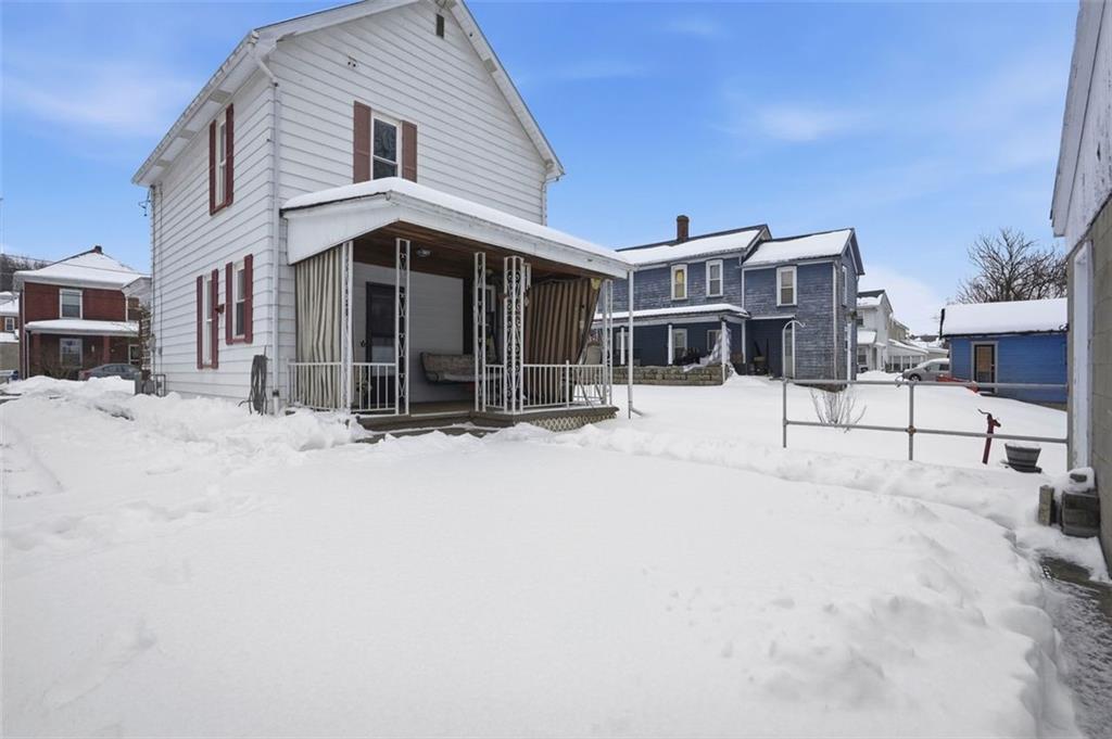 221 Kay Street Wampum, PA 16157 - Photo 36 of 39 a view of a house with snow on the road