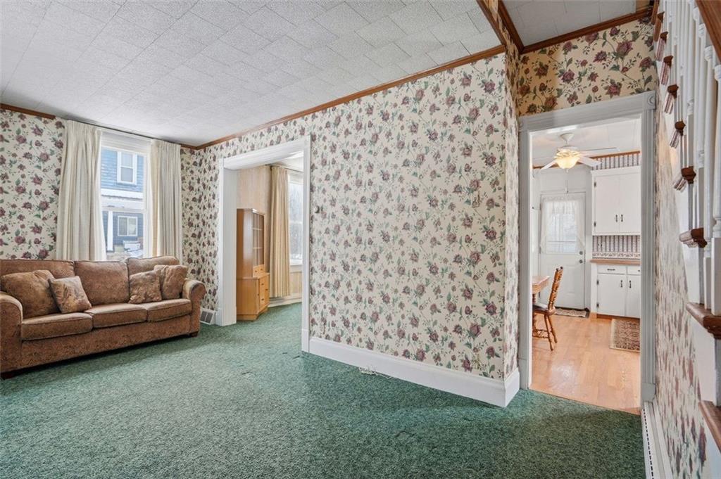 221 Kay Street Wampum, PA 16157 - Photo 8 of 39 a living room with furniture and a large window