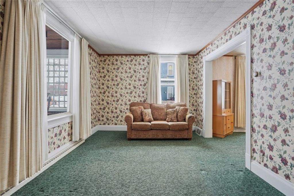 221 Kay Street Wampum, PA 16157 - Photo 9 of 39 a living room with furniture and a window