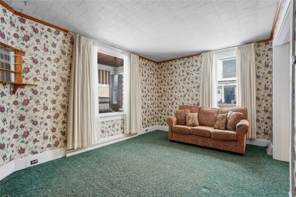 221 Kay Street Wampum, PA 16157 - Photo 10 of 39 a living room with furniture and a large window
