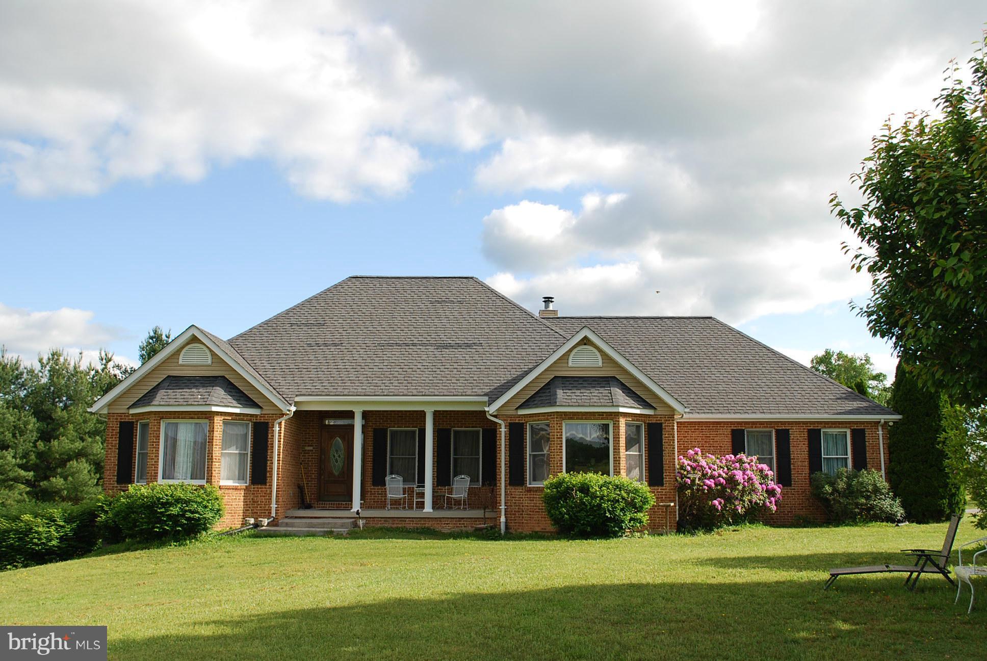 82 Resettlement Road Huntly, VA 22640 - Photo 1 of 21 a front view of a house with a garden