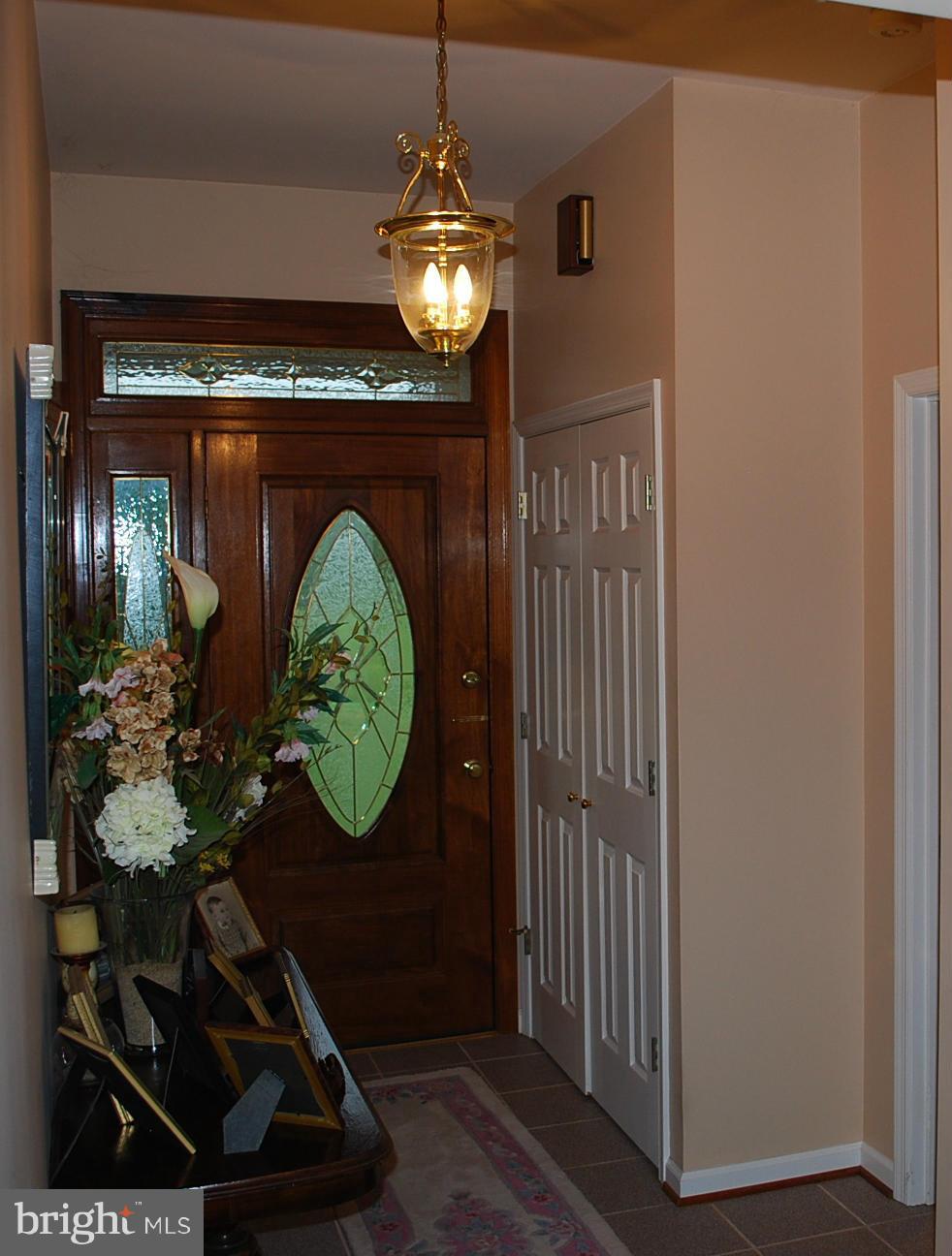 82 Resettlement Road Huntly, VA 22640 - Photo 5 of 21 a living room with furniture and a chandelier